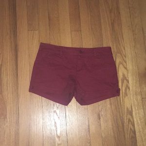 red shorts with button pockets.
